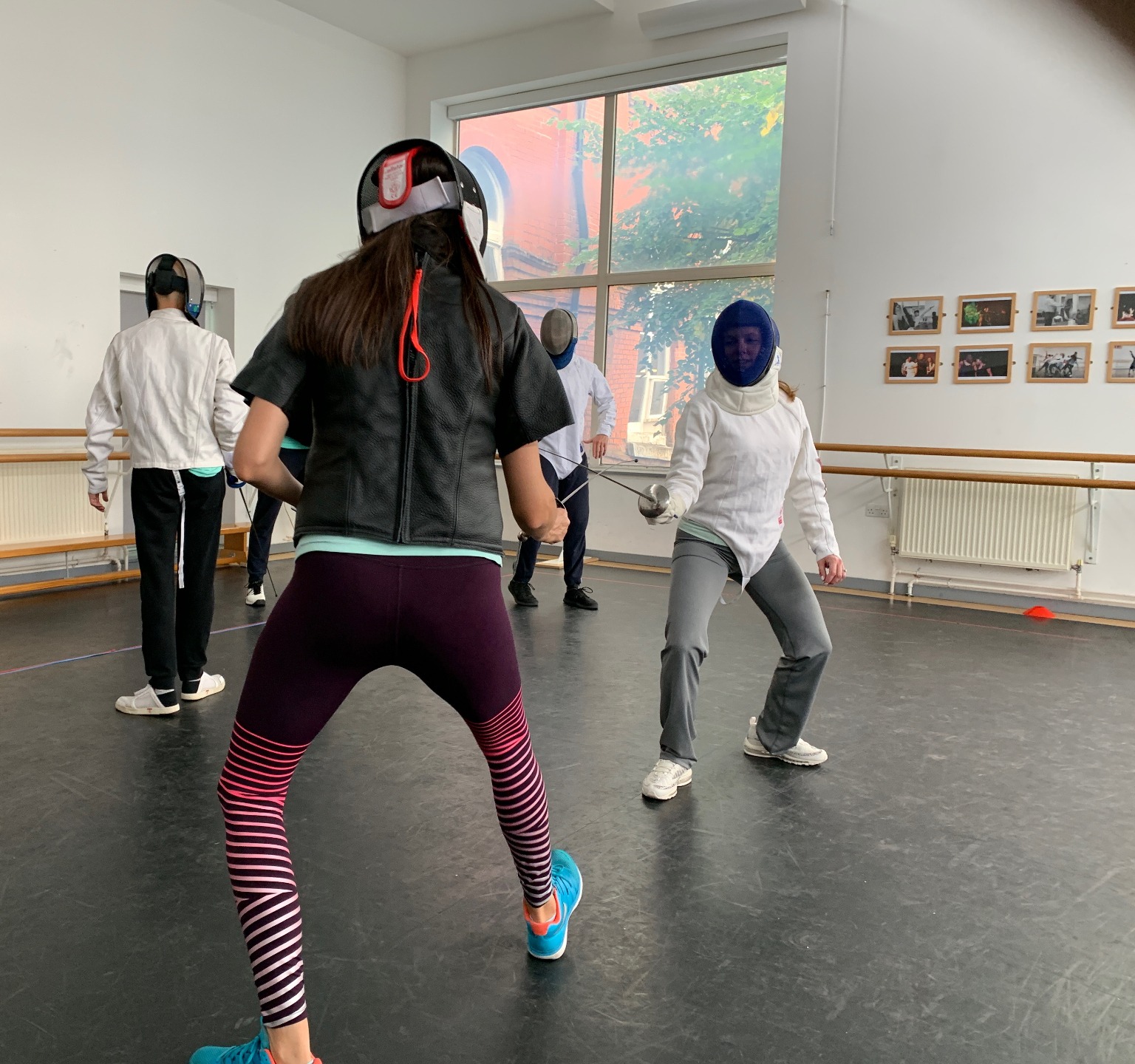 Adult fencers training together